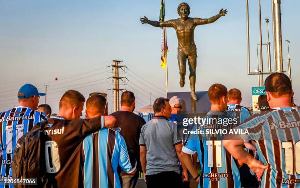 Brazil's Gremio supporters arrive at the Arena do Gremio stadium for the Copa Libertadores match against Brazil's Internacional, in Porto Alegre,...