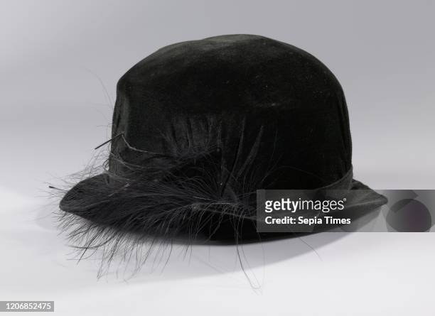 Hat of black silk velvet with a decoration of marabou feathers, Hat of black silk velvet with a decoration on the back of the hat of marabou...