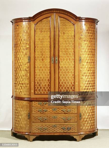 Cupboard with rectangular, forward-looking center section, flanked by two quarter-round sections. Oak, glued with various types of veneer and with...