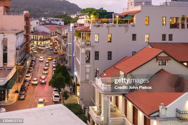 looking down at a main street in casco viejo, panama - casco viejo stock-fotos und bilder