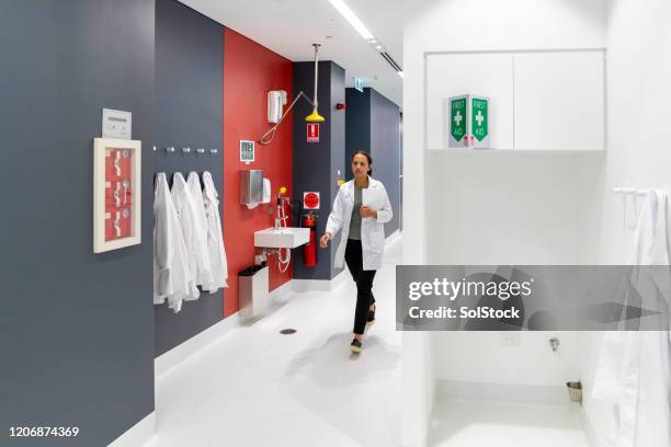 female lab technician at work - workplace first aid kit stock pictures, royalty-free photos & images