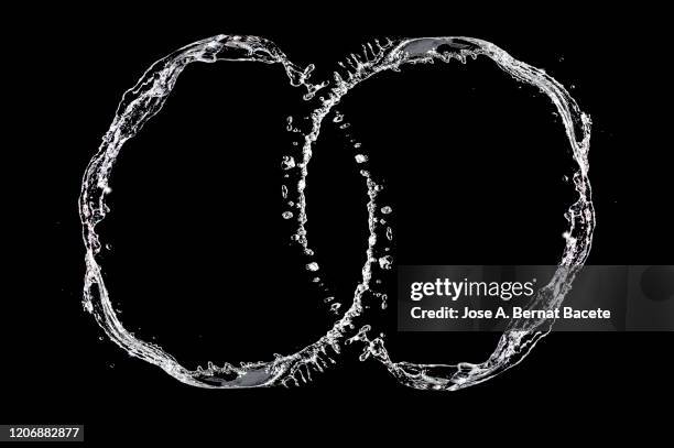 figures and abstract forms of water on a black background. - tropfen aufprall stock-fotos und bilder