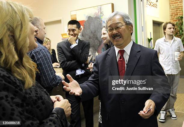 San Francisco interim Mayor Ed Lee greets a worker at Rocketspace, a shared office space for technology and media companies, after he filed paperwork...