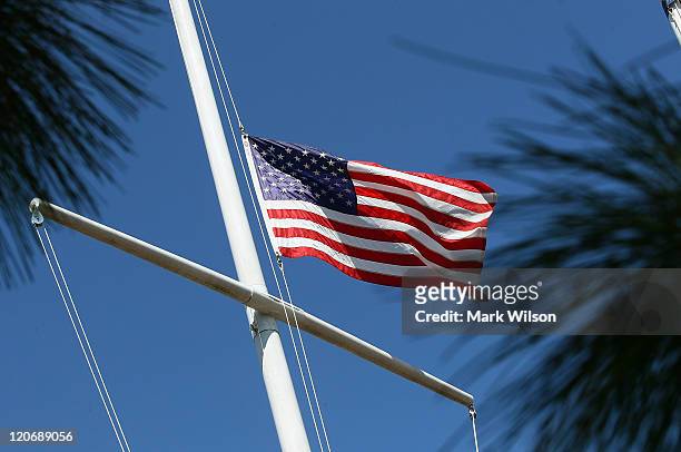 An American flag flies at half staff in front of a Veteran of Foreign War Post 392, to honor the fallen Navy SEALs who were based and trained close...