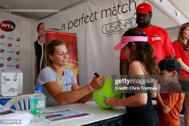 Maria Kirilenko of Russia, signs autograph for fans at the Rogers Cup presented by National Bank at the Rexall Centre on August 8, 2011 in Toronto,...