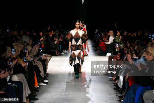 England – February 17: A model walks the runway at the Christopher Kane show during London Fashion Week at the The Mail Centre February 2020 on...