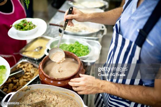 food at self service - brazilian feijoada dish stock pictures, royalty-free photos & images