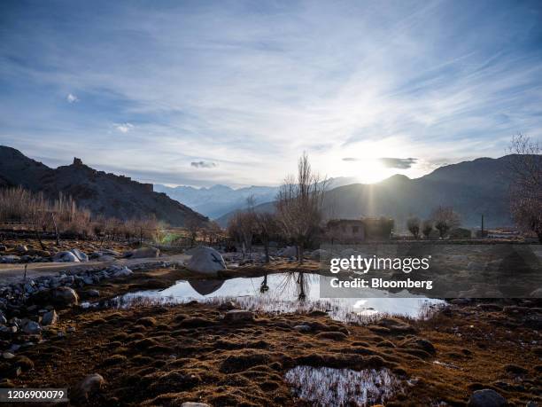 Puddles of water are seen on marshland near the Wari la pass in Leh district, Jammu and Kashmir, India, on Tuesday, Nov. 12, 2019. There is a body of...