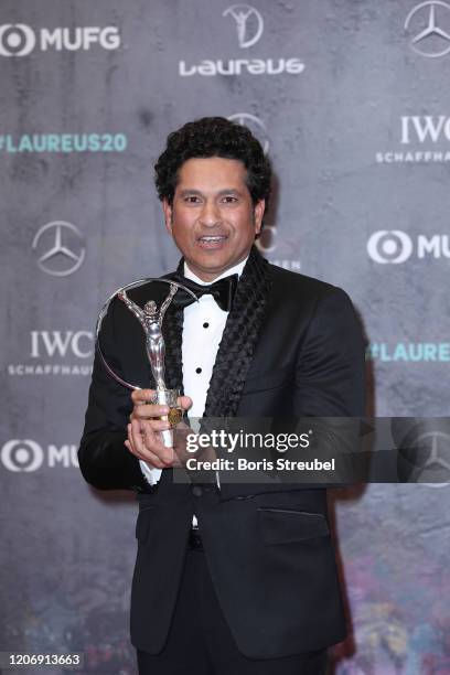 Laureus Academy Member Sachin Tendulkar and winner of the Laureus Sporting Moment poses with his award during the 2020 Laureus World Sports Awards at...