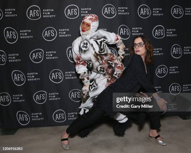 Erykah Badu receives the Soundtrack Award from Emcee Parker Posey during the Austin Film Society's 20th annual Texas Film Awards at Creative Media...