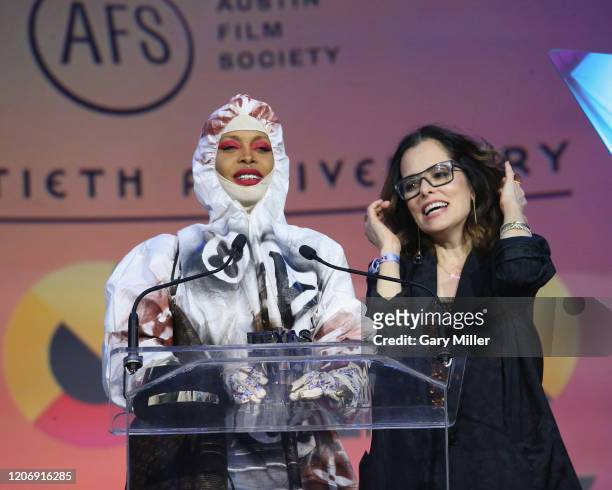 Erykah Badu receives the Soundtrack Award from Emcee Parker Posey during the Austin Film Society's 20th annual Texas Film Awards at Creative Media...