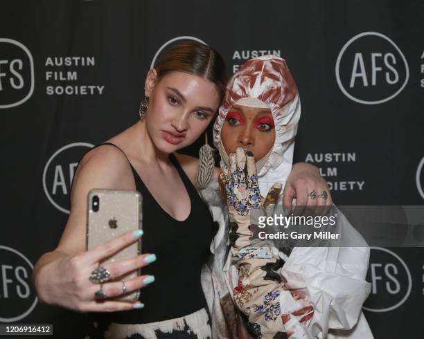 Erykah Badu poses with a fan during the Austin Film Society's 20th annual Texas Film Awards at Creative Media Center at Austin Studios on March 12,...