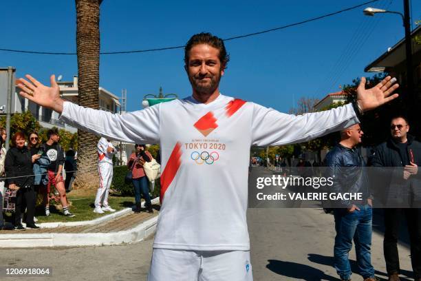 Actor Gerard Butler poses during the Olympic flame relay in Sparta on March 13, 2020 ahead of the Tokyo 2020 Olympic Games.