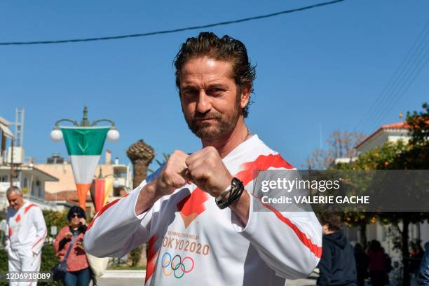 Actor Gerard Butler poses during the Olympic flame relay in Sparta on March 13, 2020 ahead of the Tokyo 2020 Olympic Games.