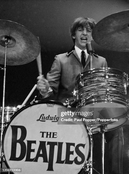 Ringo Starr of the Beatles performing on stage at the Washington Coliseum, Washington DC, February 11, 1964. The performance was their first US...