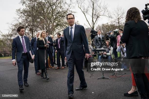 Treasury Secretary Steven Mnuchin exits after speaking to the press outside of the West Wing of the White House on March 13, 2020 in Washington, DC....