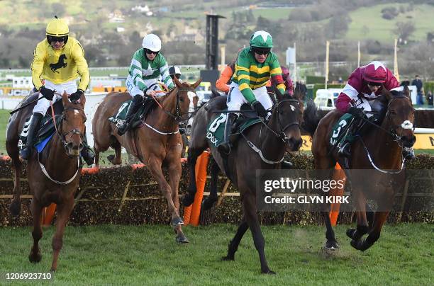 Jockey Barry Geraghty rides Saint Roi to win the Randox Health County Handicap Hurdle Race during the final day of the Cheltenham Festival horse...