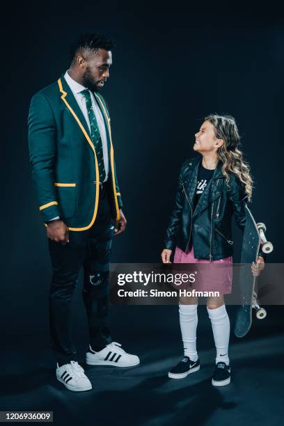 Laureus World Team of the Year Winners South Africa Rugby Union Team captain Siya Kolisi poses with skateboarder Sky Brown at the Verti Hall during...