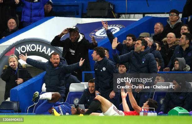 Harry Maguire of Manchester United clashes with Michy Batshuayi of Chelsea during the Premier League match between Chelsea FC and Manchester United...