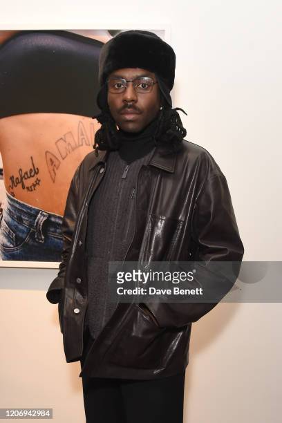 Dev Hynes attends the Renell Medrano and WePresent opening preview of PAMPARA Photographic exhibition on February 17, 2020 in London, England.