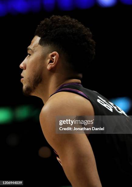 Devin Booker of the Phoenix Suns looks on in the 2020 NBA All-Star - MTN DEW 3-Point Contest during State Farm All-Star Saturday Night at the United...