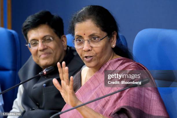 Nirmala Sitharaman, India's finance minister, right, speaks while Piyush Goyal, India's minister of railways, commerce and industry, listens during a...