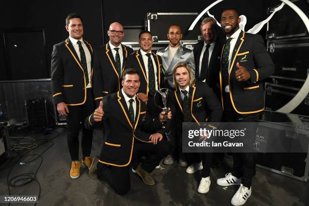 Members of Laureus World Team of the Year the South Africa Mens Rugby Team pose with Laureus World Sportsman of the Year British F1 driver Lewis...
