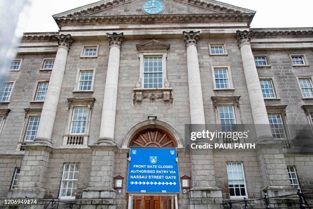 This picture shows the front of Trinty College after it closed, in Dublin on March 13, 2020. - Ireland on Thursday announced the closure of all...