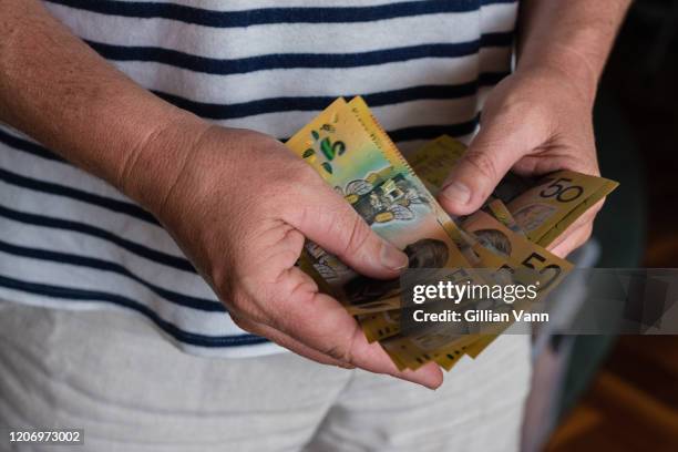 man counting australian money - stocktake stock pictures, royalty-free photos & images