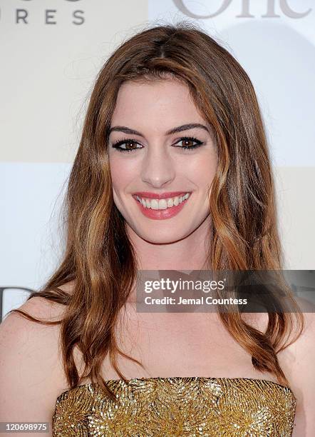Actress Anne Hathaway poses for a photo on the red carpet at the "One Day" premiere at the AMC Loews Lincoln Square 13 theater on August 8, 2011 in...