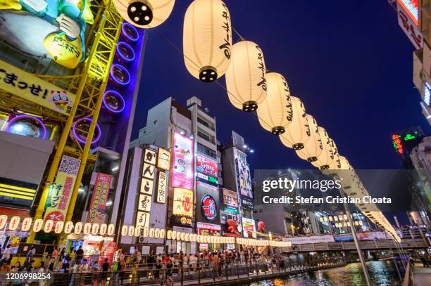 dotonbori river in osaka at night, japan - osaka city stock pictures, royalty-free photos & images
