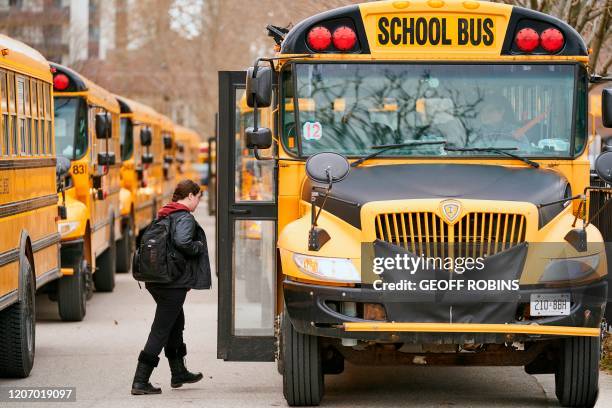 High school students leave Beal Secondary School in London, Ontario on March 13, 2020 on their last day of classes before a 3 week break imposed by...