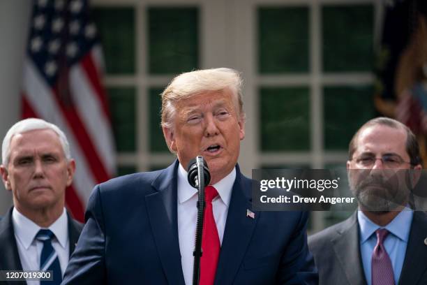 Flanked by Vice President Mike Pence and Secretary of Health and Human Services Alex Azar , U.S. President Donald Trump holds a news conference about...