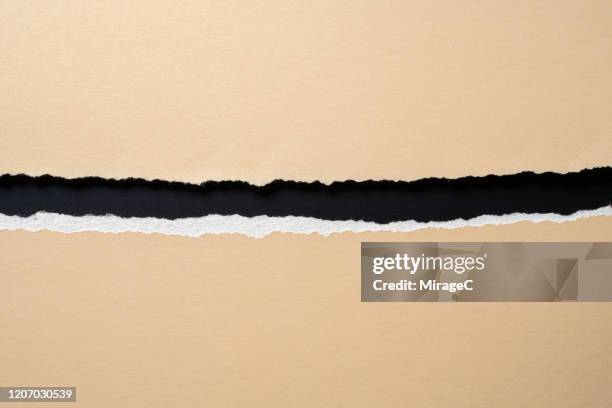 halved torn paper - strappare foto e immagini stock