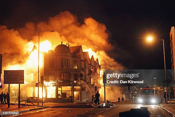 Large fire breaks out in shops and residential properties in Croydon on August 9, 2011 in London, England. Sporadic looting and clashes with police...