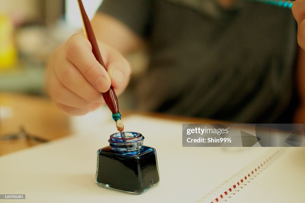 Pen in ink bottle