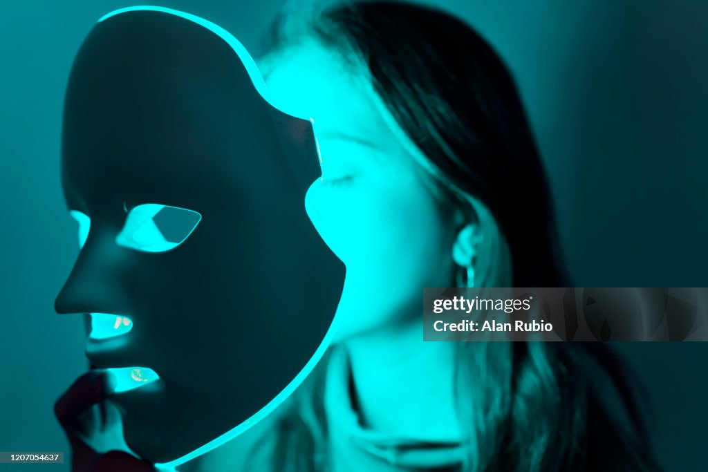 LED mask regenerative treatment applied to a young woman