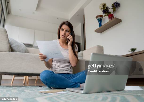 woman at home complaining about a bill on the phone - complaining stock pictures, royalty-free photos & images