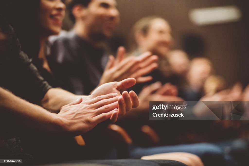 Audience applauding in the theater