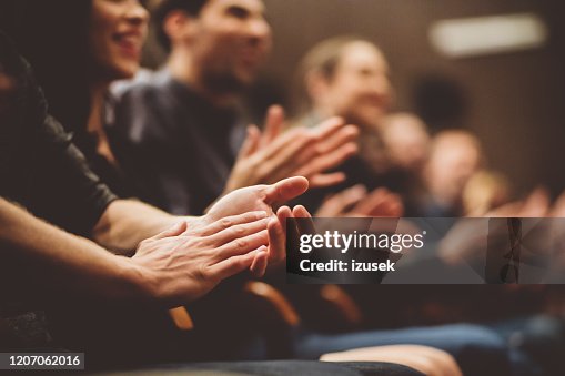 Audience applauding in the theater Audience applauding in the theater