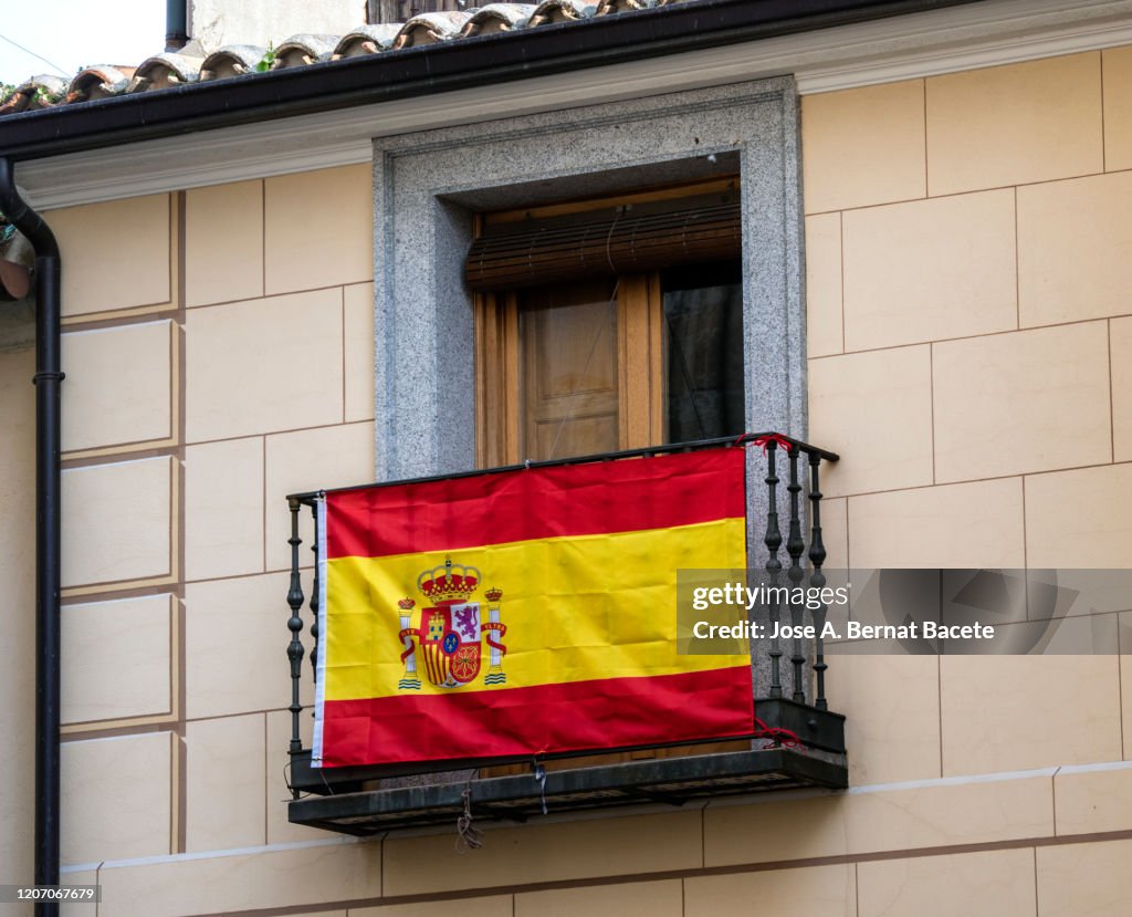 Spanish flag on a balcony.