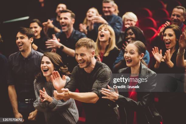 happy audience applauding in the theater - enthusiastic theater audience clapping stock pictures, royalty-free photos & images