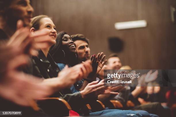 happy people applauding in the theater - comedian audience stock pictures, royalty-free photos & images