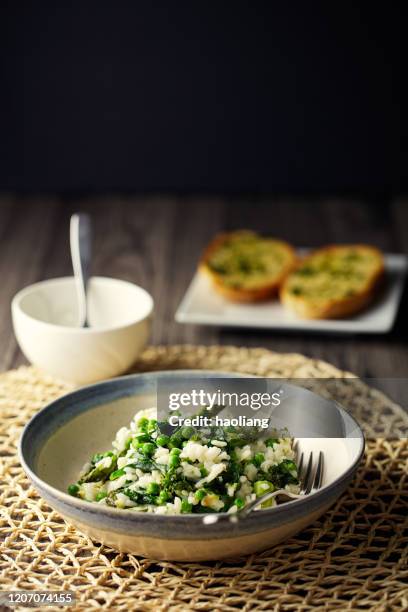 vegan asparagus,spinach garden pea risotto - risotto stock pictures, royalty-free photos & images