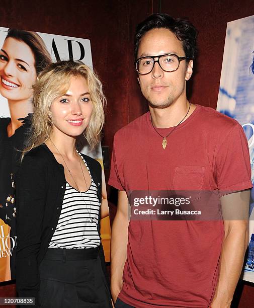 Imogen Poots and Cary Fukunaga attend the "One Day" premiere after party at the Russian Tea Room on August 8, 2011 in New York City.