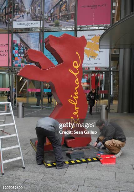 Workers set up the Berlinale bear logo outside the Arkaden mall two days before the opening of the 70th Berlinale International Film Festival on...
