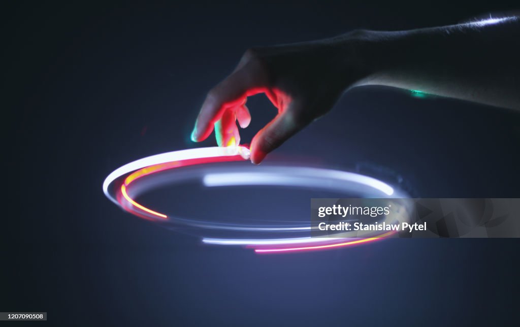 Hand controling light circle in air