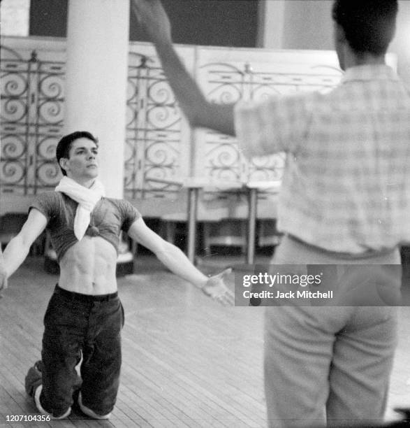 Dancer Dirk Sanders listens to choreographer Joe Layton during backstage rehearsals for Mary Martin's Easter Sunday live color telecast , 1959.