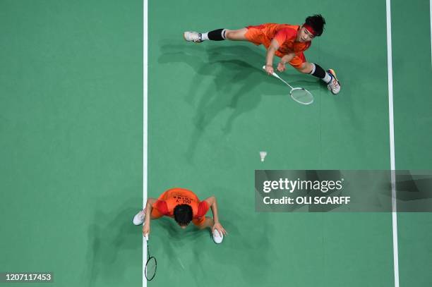 China's Du Yue and China's Li Yin Hui play a return to South Korea's Lee So Hee and South Korea's Shin Seung Chan during their All England Open...