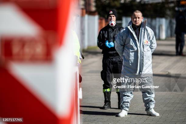 Men with protective clothing check people crossing the border on March 14, 2020 in Zgorzelec, Poland. Poland and Czech Republic decide to close the...
